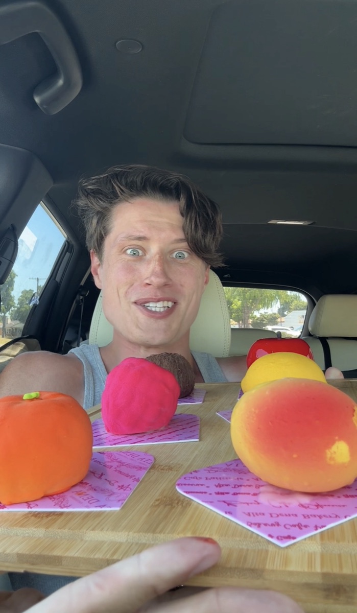 Still from a Doug video — car full of dessert fruits