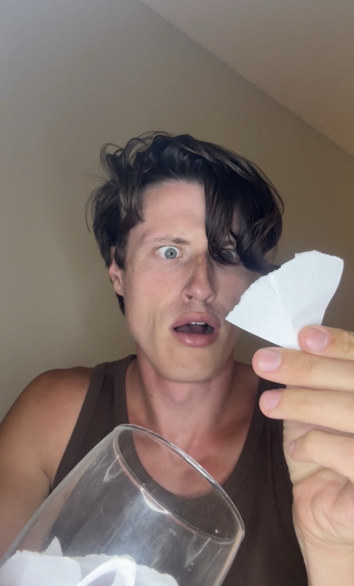 Still from a Doug video — shocked, holding broken glass